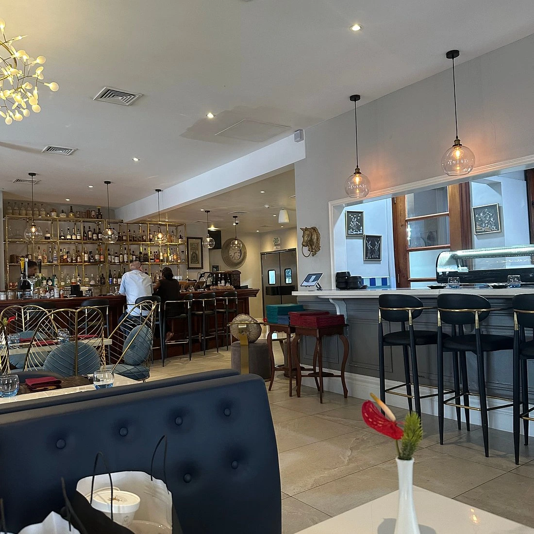 Lounge seating and dining space at Elysium Bar & Lounge.